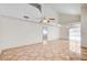 Bright living room features vaulted ceilings, ceiling fans and neutral paint with tile floor at 420 Clifton Heights Dr, Las Vegas, NV 89145