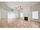 Open concept living room with ceiling fan and decorative fireplace for cozy nights at 420 Clifton Heights Dr, Las Vegas, NV 89145