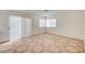 Bright, airy living space with sliding glass door and tile floors at 420 Clifton Heights Dr, Las Vegas, NV 89145