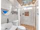 Luxurious bathroom featuring marble tiling, modern fixtures, and a walk-in shower at 4425 Sherrill Ave, Las Vegas, NV 89110