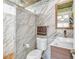 Modern bathroom showcasing a sleek sink, toilet, and stylish tile work in shower at 4425 Sherrill Ave, Las Vegas, NV 89110
