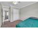 Minimalist bedroom featuring carpet, a double closet, and neutral paint at 4425 Sherrill Ave, Las Vegas, NV 89110