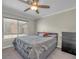 Cozy bedroom with a queen-size bed, plush carpet, and neutral tones at 4425 Sherrill Ave, Las Vegas, NV 89110