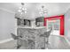 Contemporary kitchen featuring a breakfast bar, stainless steel appliances, and modern lighting at 4425 Sherrill Ave, Las Vegas, NV 89110