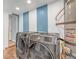 Well-lit laundry room with modern washer and dryer set and clean design at 4425 Sherrill Ave, Las Vegas, NV 89110