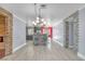 Open-concept living and kitchen area showcasing modern design and stone-accented walls at 4425 Sherrill Ave, Las Vegas, NV 89110