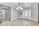 Spacious living room featuring stone accents, modern lighting, and bright neutral colors at 4425 Sherrill Ave, Las Vegas, NV 89110