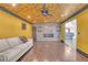 Open-concept living room featuring a fireplace, hardwood floors, and bright walls at 4425 Sherrill Ave, Las Vegas, NV 89110