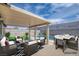 Outdoor patio boasts a dining and seating area with the pool in the background at 4425 Sherrill Ave, Las Vegas, NV 89110