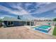 Backyard features an in-ground pool and spa, creating a private oasis for leisure at 4425 Sherrill Ave, Las Vegas, NV 89110