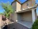 Private backyard with patio cover, gravel, and stucco wall for added privacy at 4749 Golden Shimmer Ave, Las Vegas, NV 89139