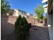 Enclosed backyard featuring gravel landscaping and privacy wall at 4749 Golden Shimmer Ave, Las Vegas, NV 89139