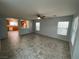 Bright living room featuring tile flooring and an open view to the kitchen at 4749 Golden Shimmer Ave, Las Vegas, NV 89139