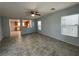 Bright living room featuring tile flooring, and an open view to the kitchen at 4749 Golden Shimmer Ave, Las Vegas, NV 89139