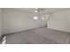 Spacious living room with plush carpet and neutral tones at 4940 Canna Lily St, Las Vegas, NV 89122