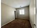 Comfortable bedroom boasts neutral walls, plush carpeting, a window for natural light, and closet access at 5524 Markley Ave, Las Vegas, NV 89141