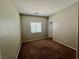 Cozy bedroom features neutral walls, plush carpeting, and a window offering natural light at 5524 Markley Ave, Las Vegas, NV 89141