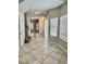 Inviting entryway with tile flooring, neutral walls, stairway, and views to other rooms in the home at 5524 Markley Ave, Las Vegas, NV 89141