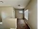 Upstairs hallway with carpet floors, neutral walls, and a window letting in natural light at 5524 Markley Ave, Las Vegas, NV 89141