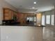 Open kitchen with stainless steel appliances, granite countertops, and ample cabinet space for storage at 5524 Markley Ave, Las Vegas, NV 89141