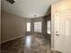 Spacious living room features tile flooring, neutral walls, and multiple windows providing ample natural light at 5524 Markley Ave, Las Vegas, NV 89141