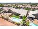 Aerial view of backyard with desert landscaping, pool, and covered patio at 5586 Golden Leaf Ave, Las Vegas, NV 89122