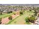 Aerial view of well-maintained golf course amongst houses with mature landscaping at 5586 Golden Leaf Ave, Las Vegas, NV 89122