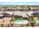 An aerial view of a backyard featuring a pool, desert landscaping, and a covered patio at 5586 Golden Leaf Ave, Las Vegas, NV 89122