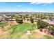 Aerial view overlooking the lush green golf course with scenic cityscape in the background at 5586 Golden Leaf Ave, Las Vegas, NV 89122