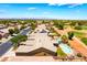 Expansive aerial view showcases homes near a green golf course at 5586 Golden Leaf Ave, Las Vegas, NV 89122