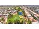 Overhead view of a golf course lined with residences, complemented by a scenic pond at 5586 Golden Leaf Ave, Las Vegas, NV 89122