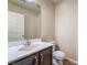Powder room featuring a dark vanity and white sink at 5586 Golden Leaf Ave, Las Vegas, NV 89122