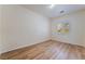 Bright bedroom features wood flooring, neutral walls, and a window with natural light at 5586 Golden Leaf Ave, Las Vegas, NV 89122
