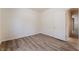 Bedroom with wood floor and a door to bathroom, offering a comfortable and private retreat at 5586 Golden Leaf Ave, Las Vegas, NV 89122