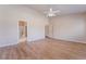 Large bedroom with hard surface floors and multiple doorways at 5586 Golden Leaf Ave, Las Vegas, NV 89122