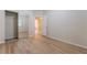 A cozy bedroom with wood-like flooring, closet, and ample natural light creating an inviting space at 5586 Golden Leaf Ave, Las Vegas, NV 89122