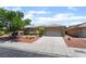 Well-maintained single-Gathering home with a two-car garage, mature trees, and attractive landscaping at 5586 Golden Leaf Ave, Las Vegas, NV 89122
