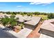 Single-story home featuring a three-car garage, lush landscaping and a well maintained driveway at 5586 Golden Leaf Ave, Las Vegas, NV 89122