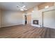The living room showcases wood flooring, a decorative fireplace, recessed lights, and high ceilings at 5586 Golden Leaf Ave, Las Vegas, NV 89122