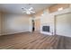 The living room showcases wood flooring, a decorative fireplace, recessed lights, and high ceilings at 5586 Golden Leaf Ave, Las Vegas, NV 89122