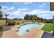 Backyard pool with tanning deck, green grass, and mountain views in a desert landscape at 5586 Golden Leaf Ave, Las Vegas, NV 89122