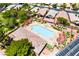 Community pool featuring a large rectangular pool with an attached jacuzzi and plenty of lounge chairs around the pool deck at 5586 Golden Leaf Ave, Las Vegas, NV 89122