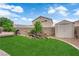 Large backyard with green lawn, shed, and mature tree at 6108 Shallow Springs St, Las Vegas, NV 89130