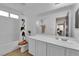 Well-lit bathroom with a shower, vanity, and wood-look flooring at 6108 Shallow Springs St, Las Vegas, NV 89130