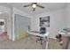 Bright and airy bedroom with a ceiling fan and ample space for work or relaxation at 6108 Shallow Springs St, Las Vegas, NV 89130