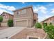 Charming two-story home with a well-maintained front yard and two-car garage at 6108 Shallow Springs St, Las Vegas, NV 89130