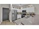 Modern kitchen with stainless steel appliances and granite countertops at 6108 Shallow Springs St, Las Vegas, NV 89130