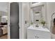 Bright half bathroom with a modern vanity and mirror at 6108 Shallow Springs St, Las Vegas, NV 89130