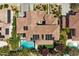 Stunning aerial view of a tile-roofed home with a sparkling pool and lush landscaping in a desirable neighborhood at 631 Coriander Canyon Ct, Las Vegas, NV 89138