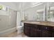 Neutral bathroom with dark cabinets, granite counters, and shower-tub combo with curtain at 631 Coriander Canyon Ct, Las Vegas, NV 89138